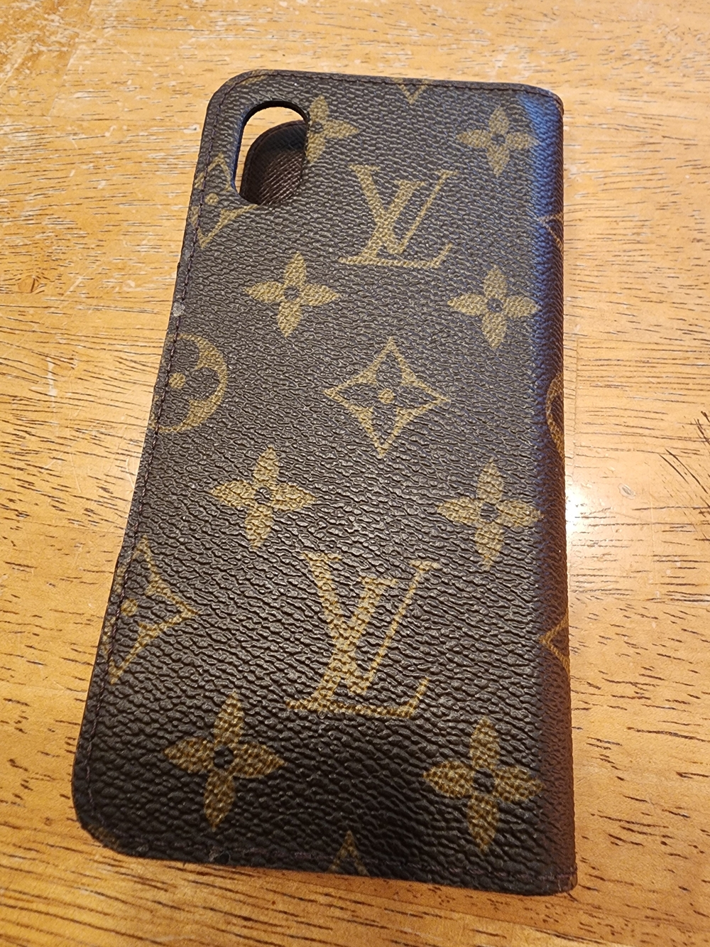 Louis Vuitton Monogram iPhone case features the signature coated canvas XS/S